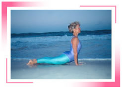 photo of Karin doing yoga on the beach